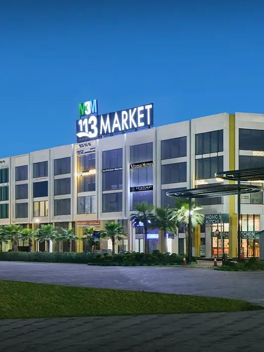 M3M 113 Market – SCO frontage lit up at dusk