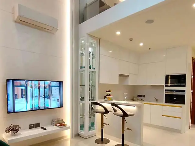 M3M 57th Suites – sample suite living and kitchen (photograph)