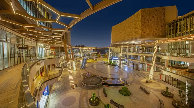 M3M 65th Avenue – central plaza and walkways at dusk (photograph)