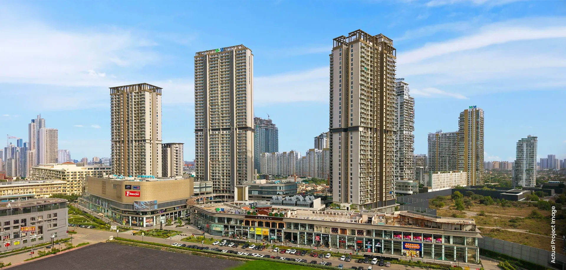 M3M 65th Avenue, Sector 65 Gurgaon – completed high-street retail with M3M residential towers behind (photograph)