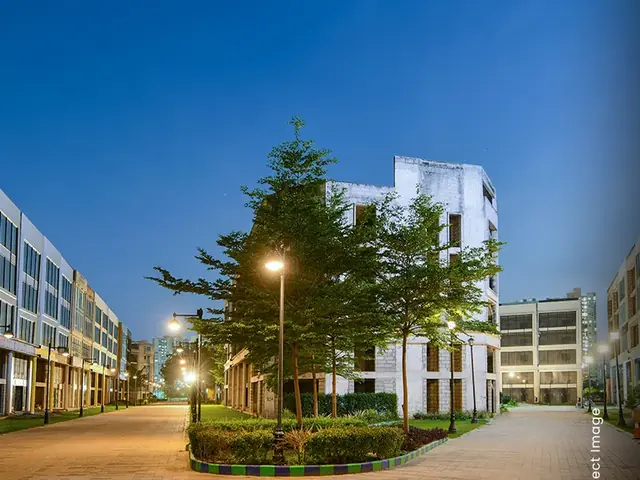 M3M 84 Market – completed SCO buildings along a landscaped street