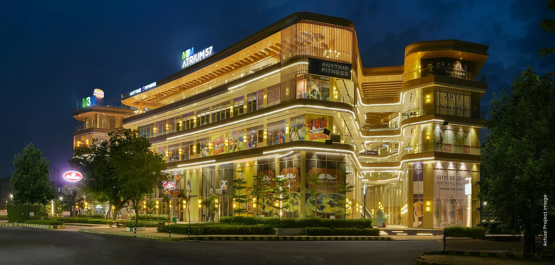 M3M Atrium57, Sector 57 Gurgaon – completed retail building lit up at night with tenant signage (photograph)