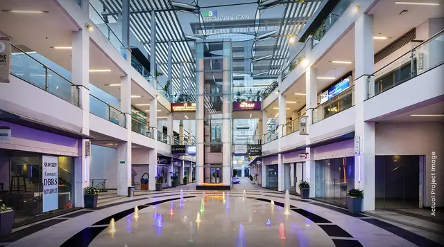 M3M Cosmopolitan – skylit multi-level retail atrium (actual photograph)