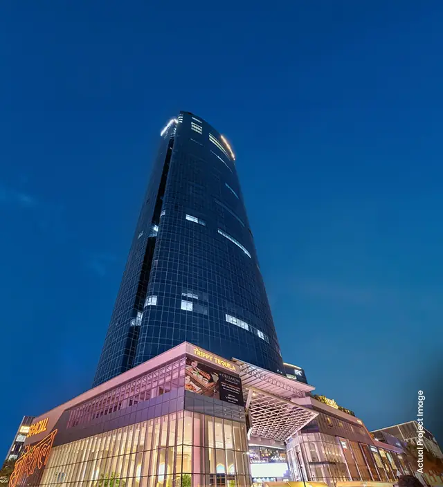 M3M IFC – tower and retail entrance at dusk (actual photograph)