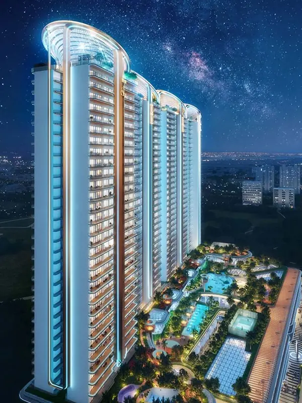M3M Jacob & Co Noida, tower elevation at night with the podium pools below (artist's impression)