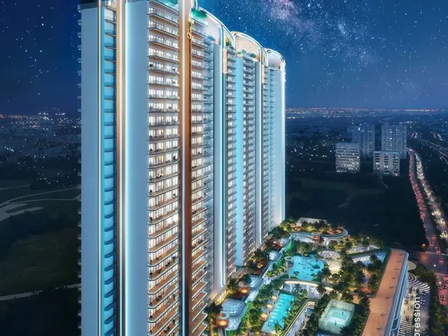 M3M Jacob & Co Noida, tower elevation at night with the podium pools below (artist's impression)
