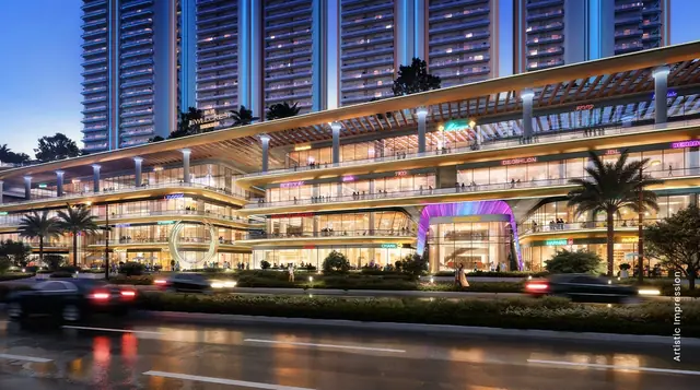M3M Jewel Crest Avenue, lit shopfronts and entrance arch along the road (artist's impression)