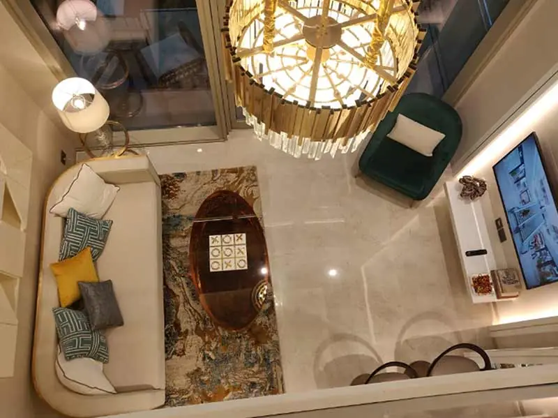 M3M Lofts 74 – double-height living room seen from the mezzanine