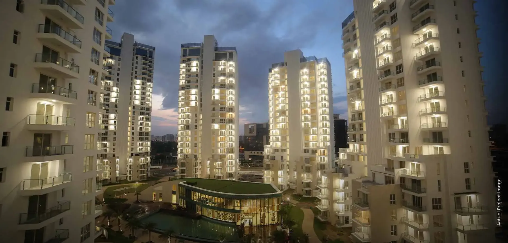 M3M Merlin – towers around the central green at night (actual photograph)
