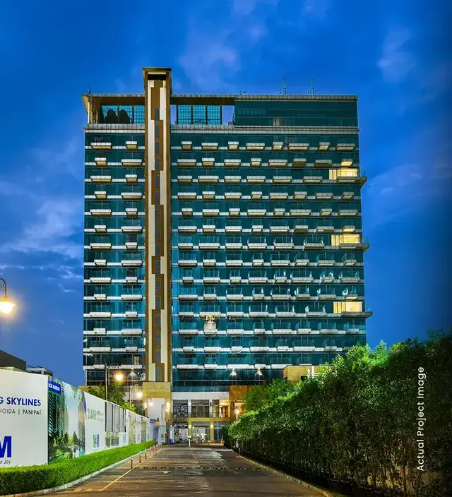 M3M My Den – tower at dusk from the approach road (actual photograph)