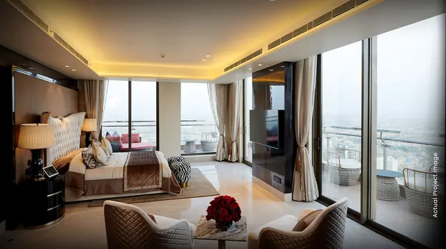 M3M SkySuites – master bedroom with city views (actual photograph)