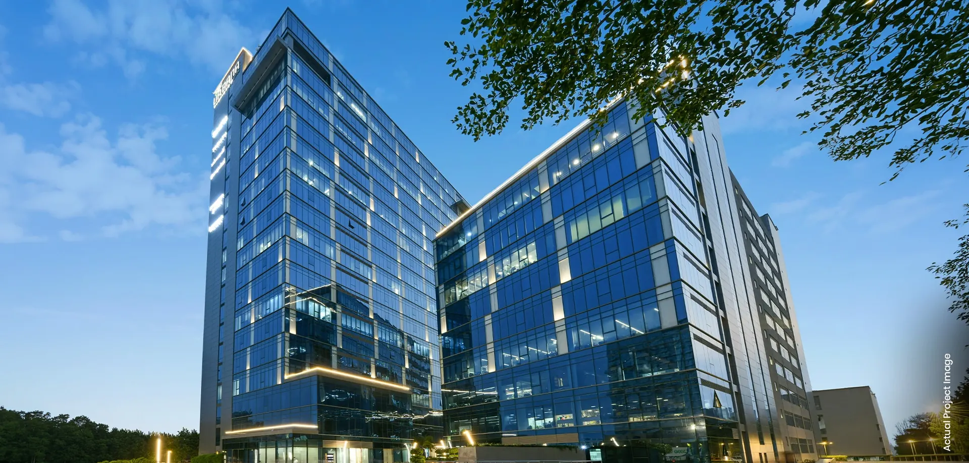 M3M Urbana Business Park – North and South office towers at dusk (actual photograph)
