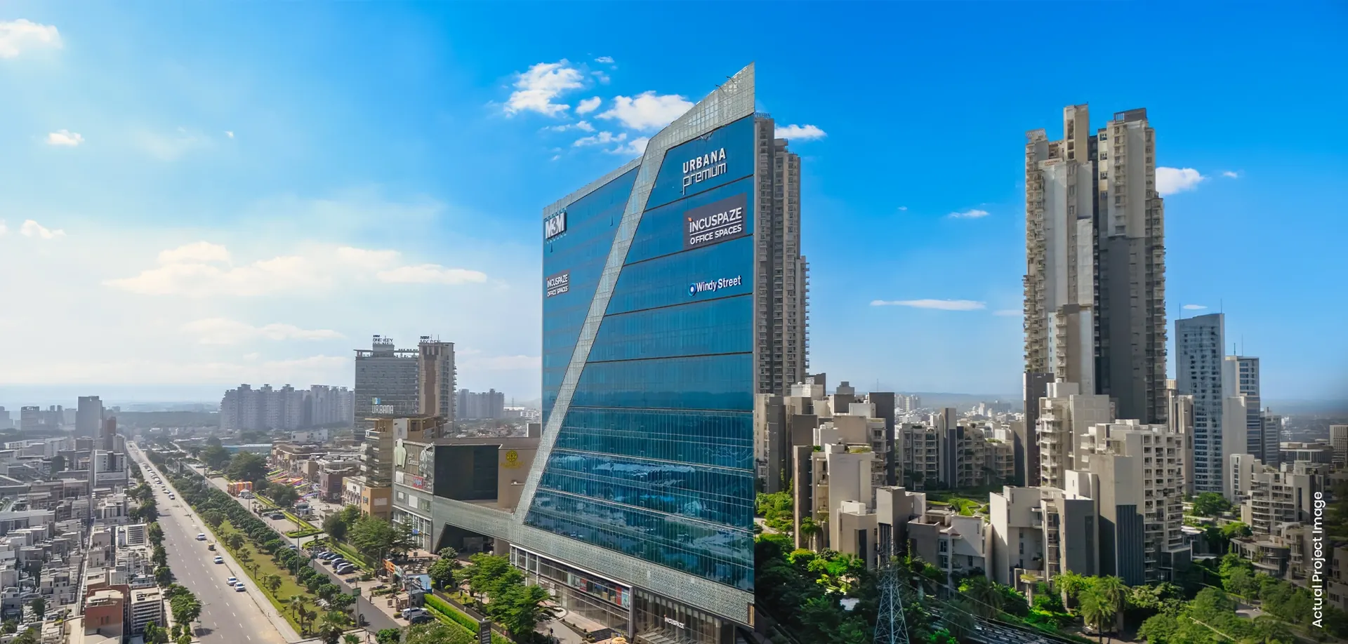 M3M Urbana Premium – glass office tower above Sector 67 (actual photograph)