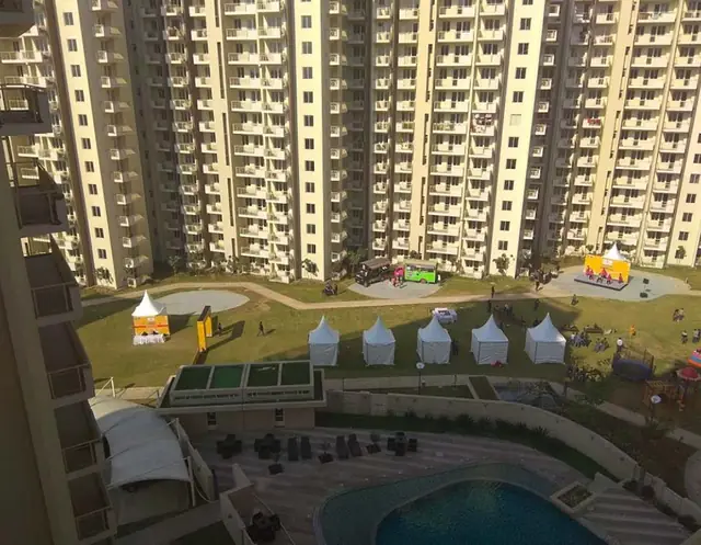 M3M Woodshire – central lawn between the towers (actual photograph)