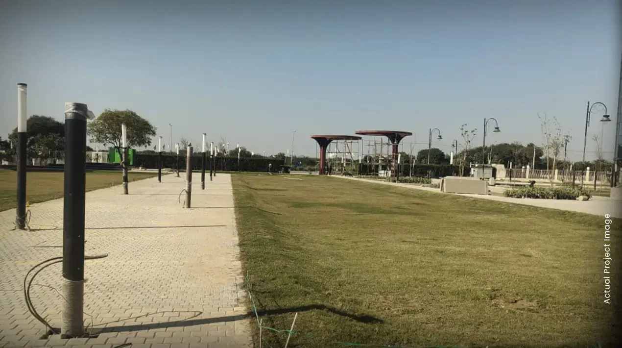 M3M Xpressway 114 – paved walkway and bollards (actual photo)